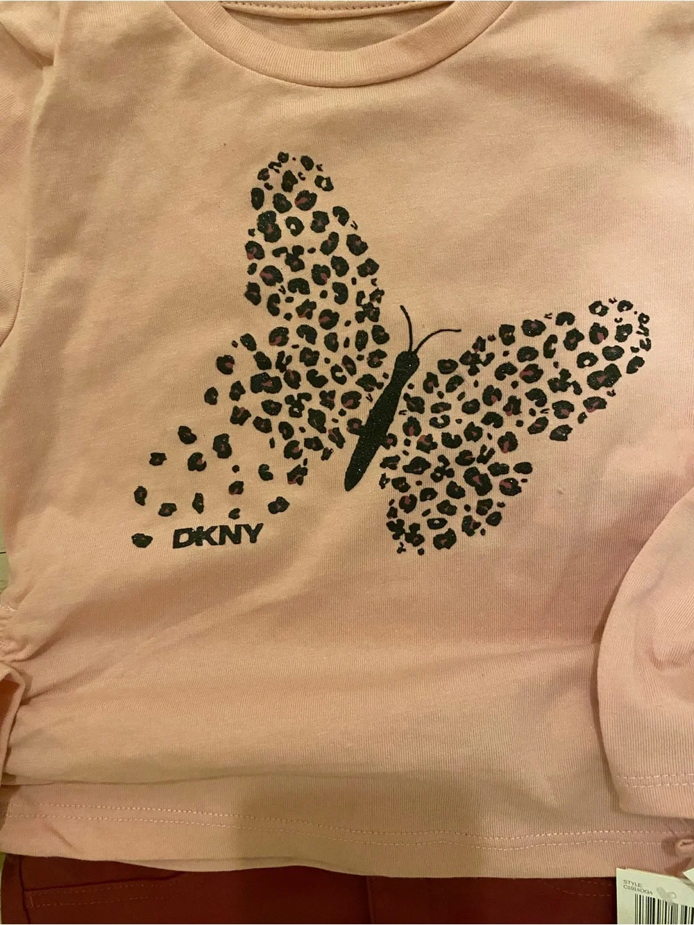 DKNY Pink Long-Sleeve Tee with Leopard Butterfly Print and leather skirt